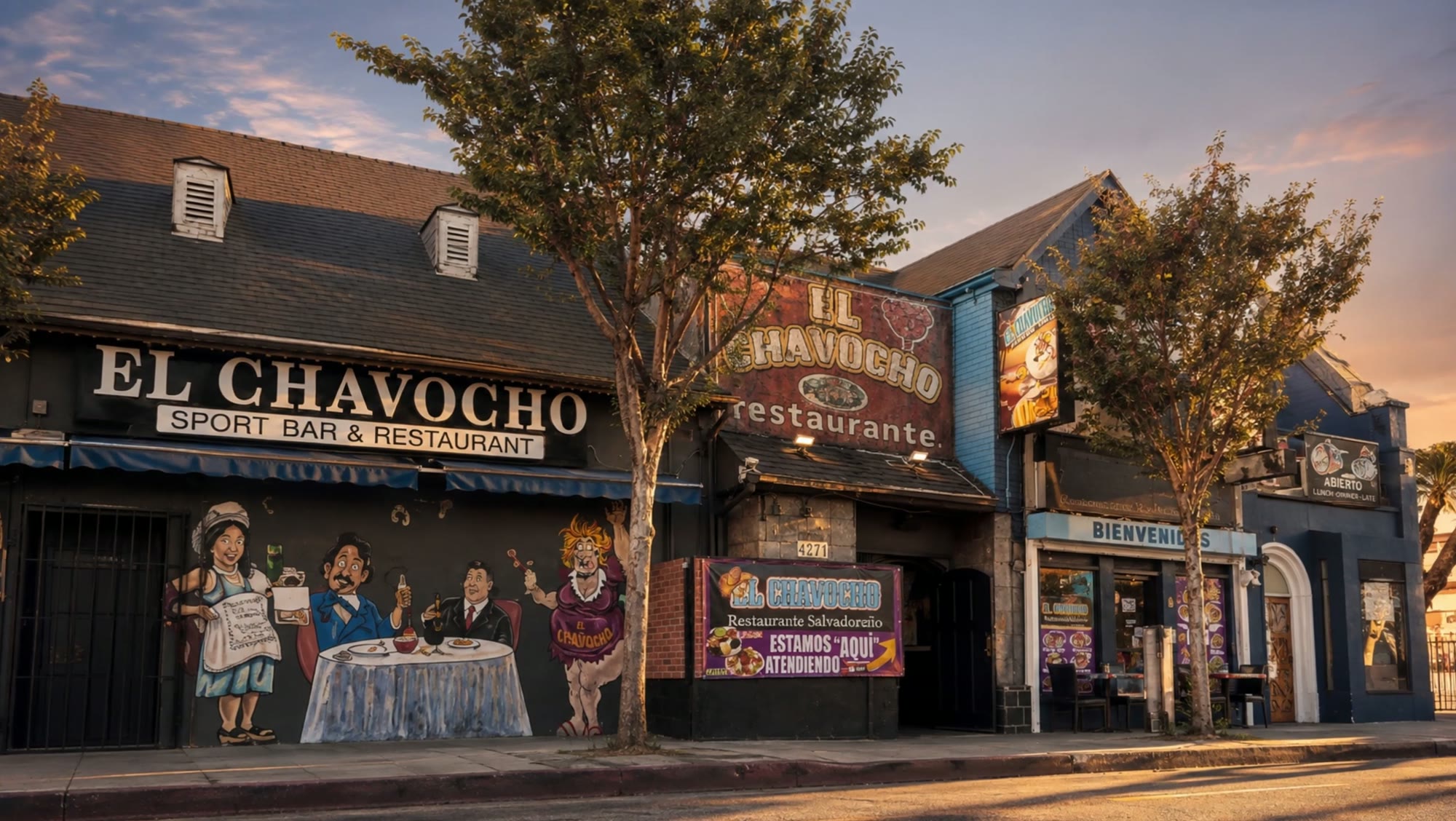 El Chavocho Sport Bar and Restaurant storefront at golden hour — red painted facade, hand-painted lettering and mural on Beverly Blvd